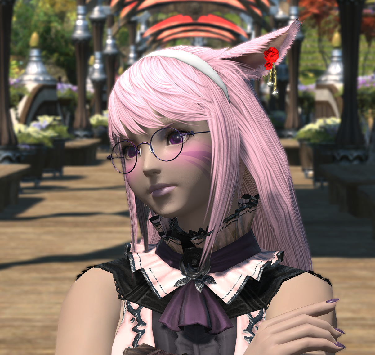 A pastel pink haired Miqo'te woman looking to the left.